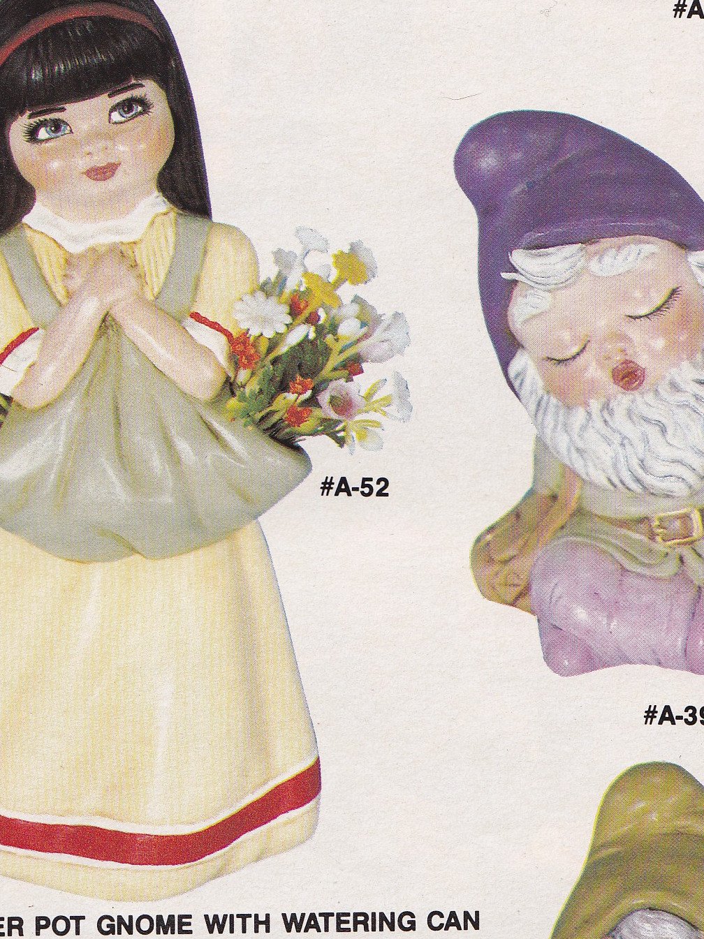 Finished ceramic example produced from Alberta mold A 52: Small Girl with flowers in apron 7 1/8" h